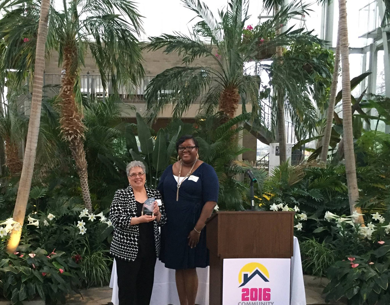 CDA Alana Green, CDA Executive Director, presenting JoAnn Spitale with the 2016 Outstanding Service Award